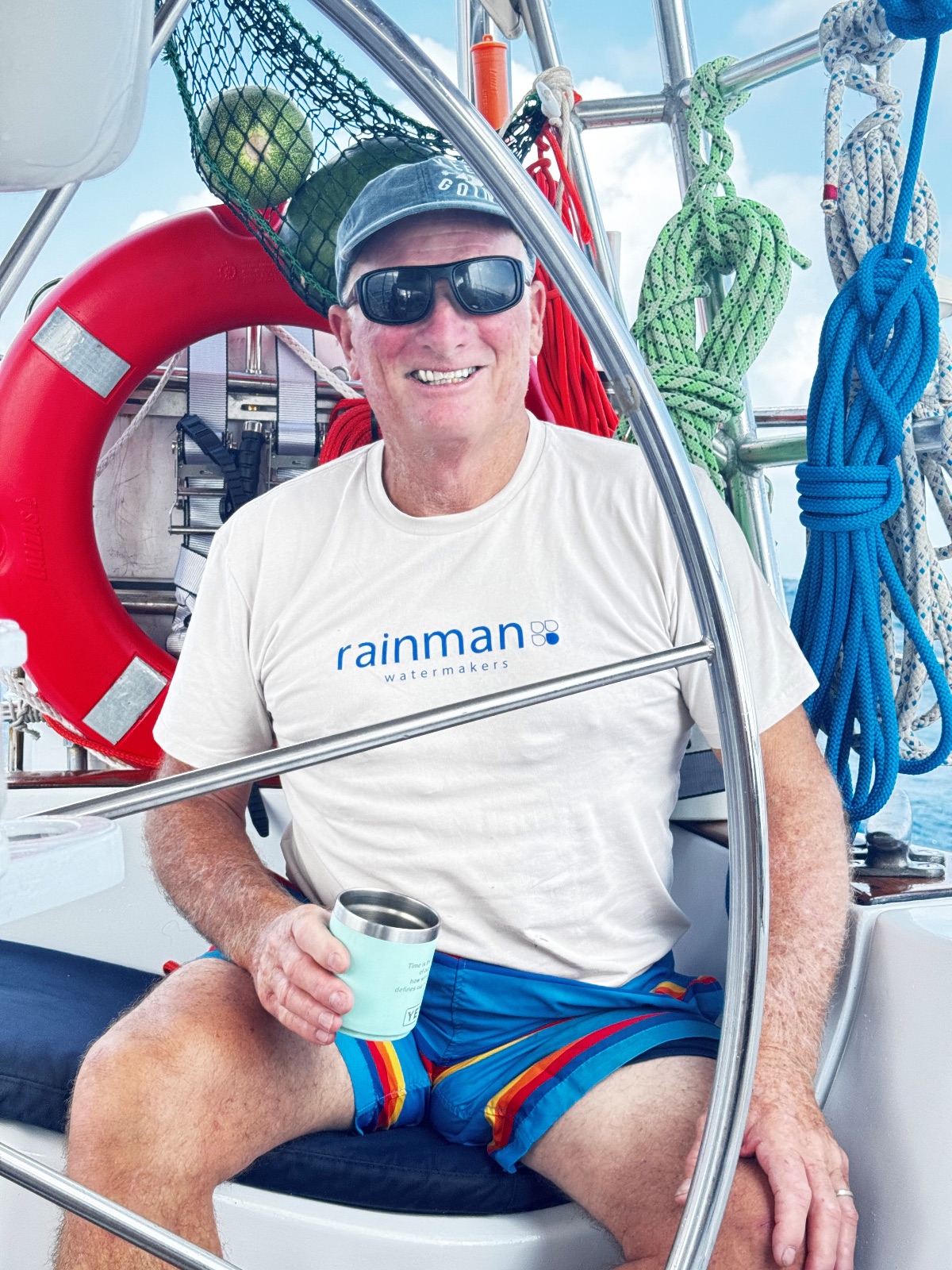 John Kretschmer, Captain and owner of SV Quetzal enjoying some coffee at the helm