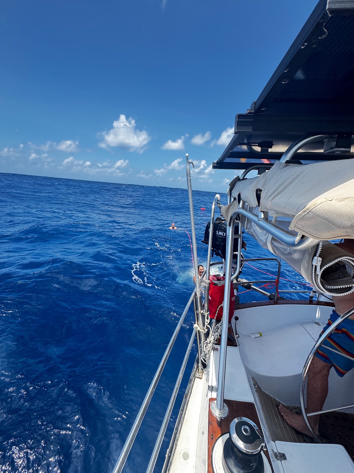 Winds were calm. Swimming midday with sails dropped.